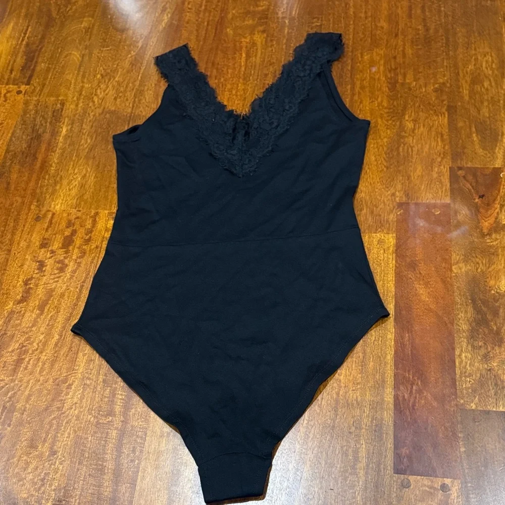 H&M Sexy Black Lace Trim Bodysuit size 8 fits like an M
